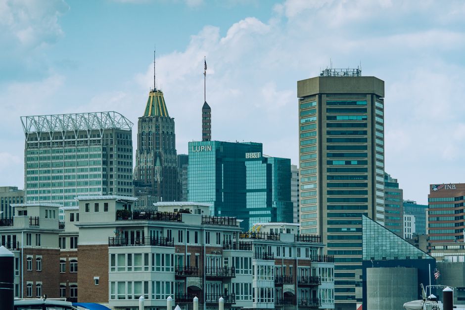 A vibrant view of Baltimore cityscape featuring iconic skyscrapers under a clear sky.