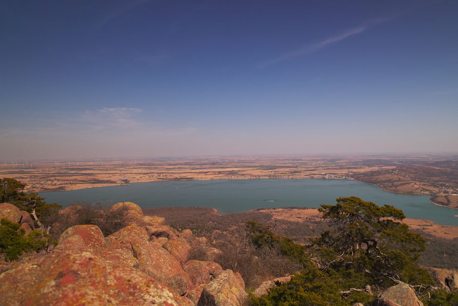 Breathtaking panoramic view of Lake Lawtonka and surrounding landscape from a mountain top in Oklahoma.