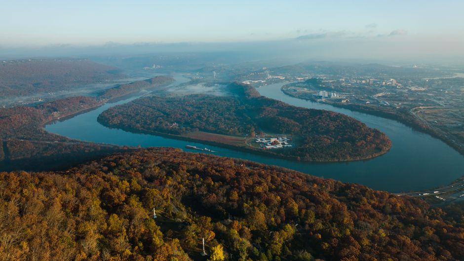 A stunning aerial view of the winding river and lush landscape in Chattanooga, Tennessee, during fall.