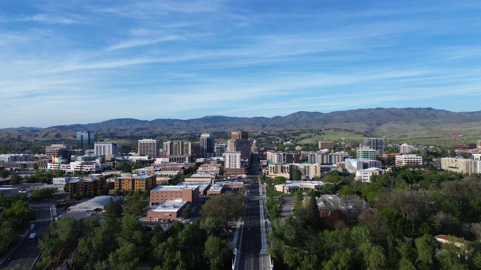 Stunning aerial capture of Boise, Idaho skyline with mountains in the background.