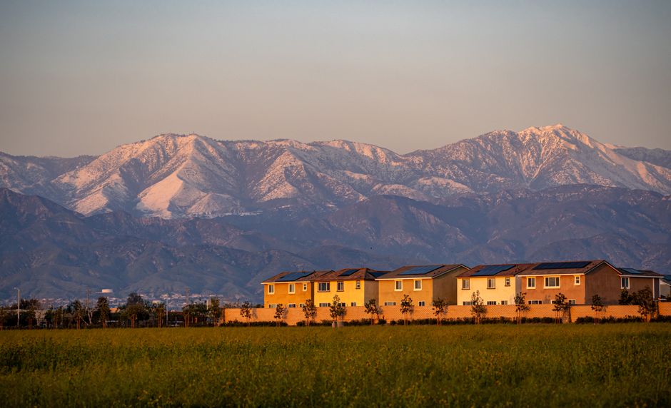 Suburban houses at sunset with mountains behind