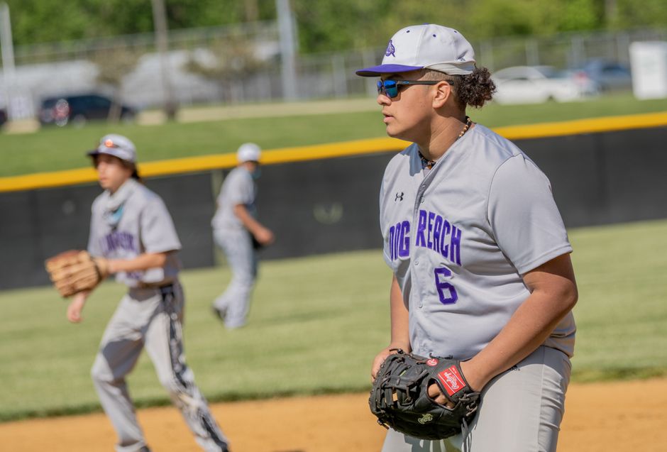 High school baseball players focus on the game in Columbia, Maryland.