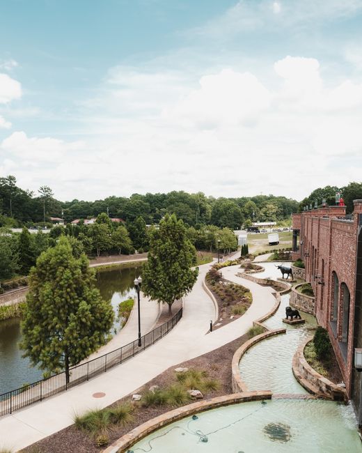 Scenic aerial view of canal and walkway in Sugar Hill, GA, USA on a sunny day.
