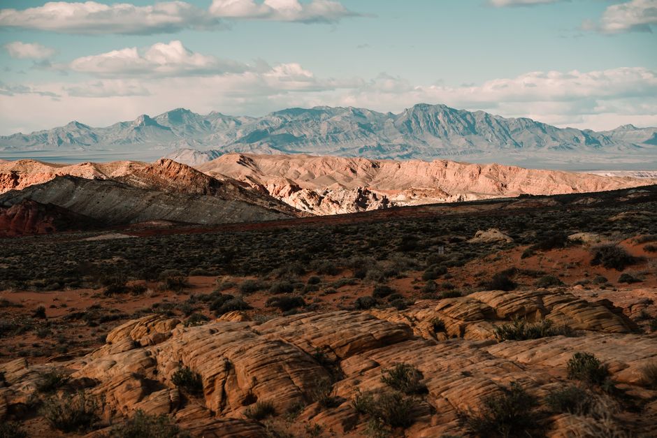Breathtaking view of the vast desert landscape in Moapa Valley, Nevada under a clear blue sky.
