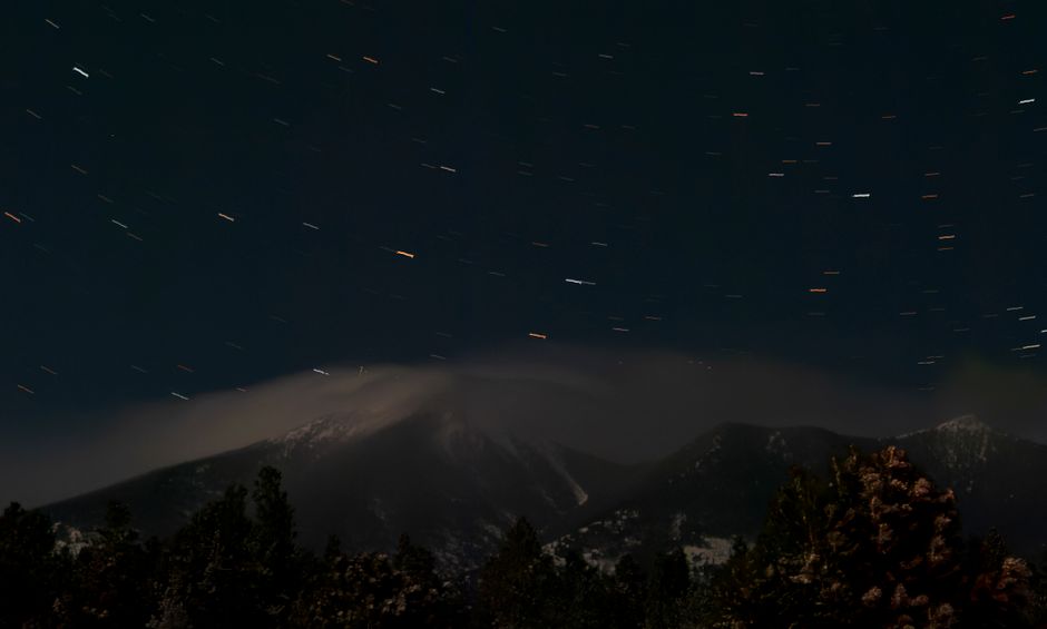 Capture of a star-filled night sky above the San Francisco Peaks in Flagstaff, Arizona.