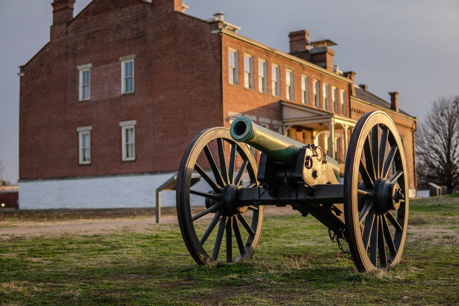 Cannon in front of a historic building at Fort Smith National Historic Site in Arkansas.