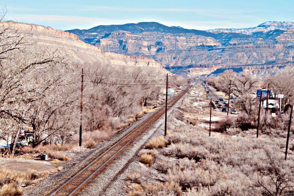 Aerial view of railway tracks and road in the stunning landscape of Grand Junction, Colorado.