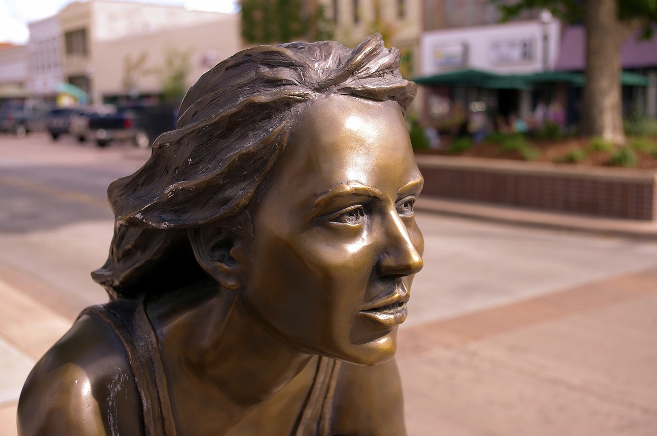 Freewheelin, bronze, sculpture, young, female, grand, junction, colorado, statue, artwork, figure, woman, face, girl, person, caucasian, white, art, corner
