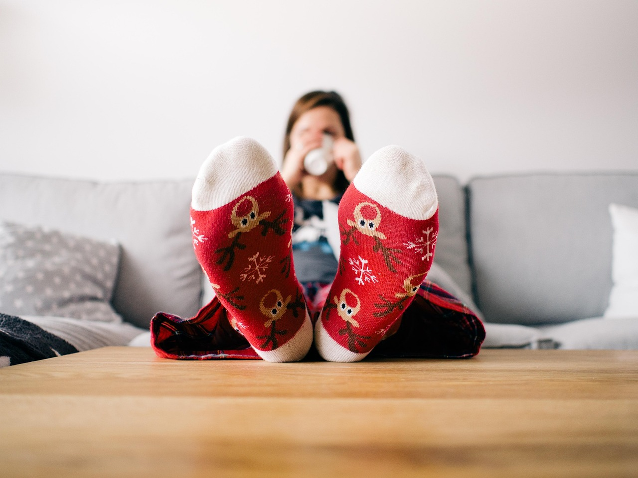 Christmas wallpaper, feet, socks, living room, person, relaxing, table, couch, woman, lazy, pajamas, xmas, reindeer, relax, warm, home, sitting, female, human, comfortable, relaxation, cozy
