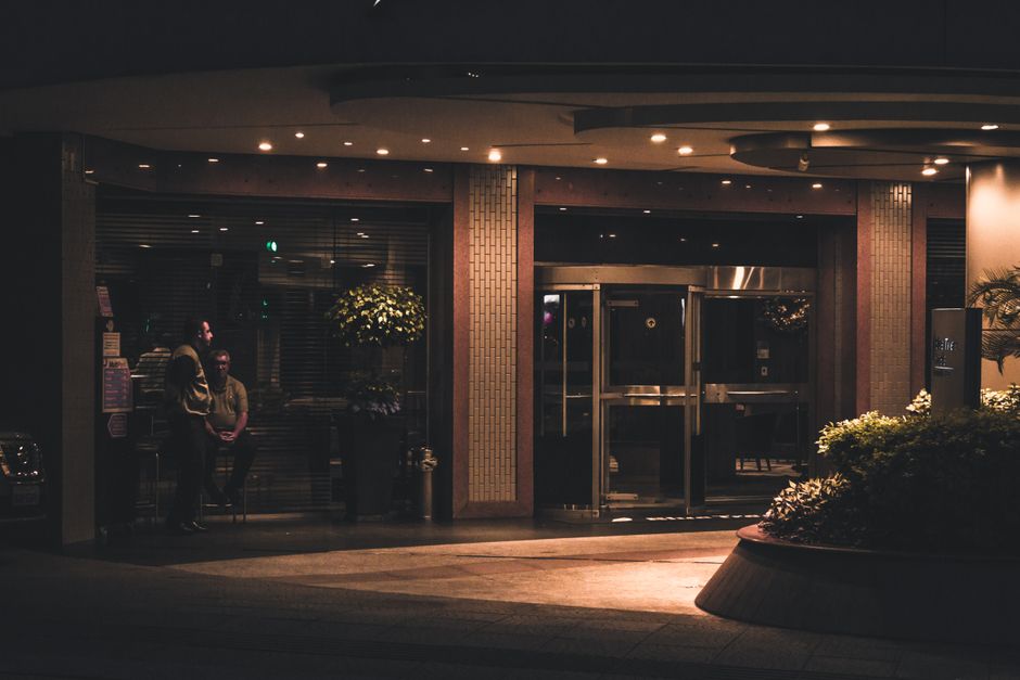 A sophisticated hotel entrance with contemporary lighting and stylish design.