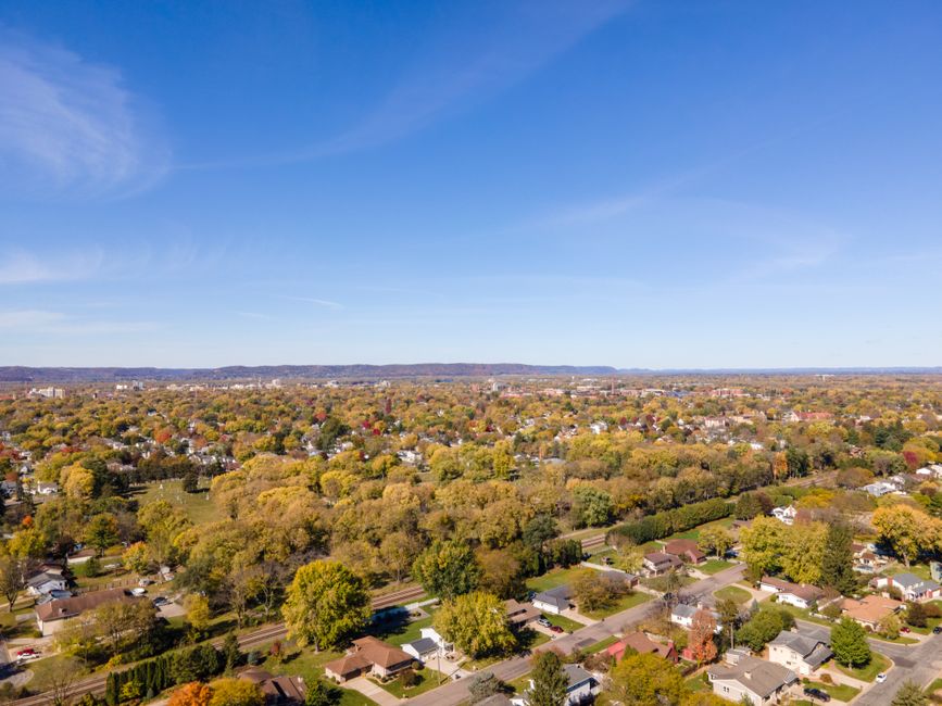 A vibrant aerial image showcasing residential areas and fall foliage in La Crosse, Wisconsin.