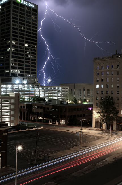 Striking lightning illuminates Little Rock at night, capturing urban excitement and natural power.