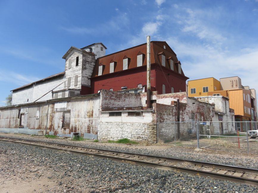 Explore rustic industrial buildings along the train tracks in Loveland, Colorado.