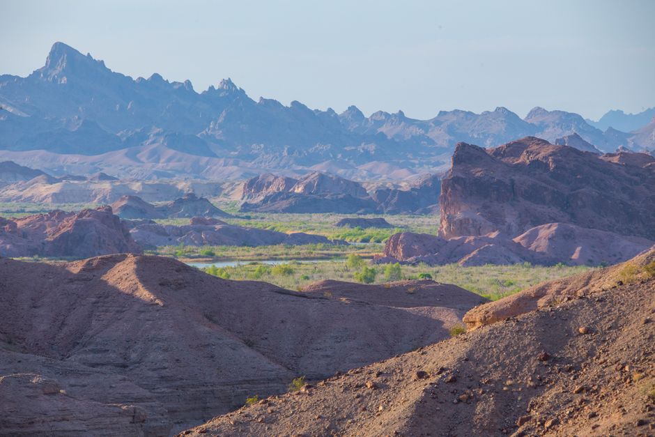 Breathtaking view of Arizona's rocky desert landscape with distant mountain range.