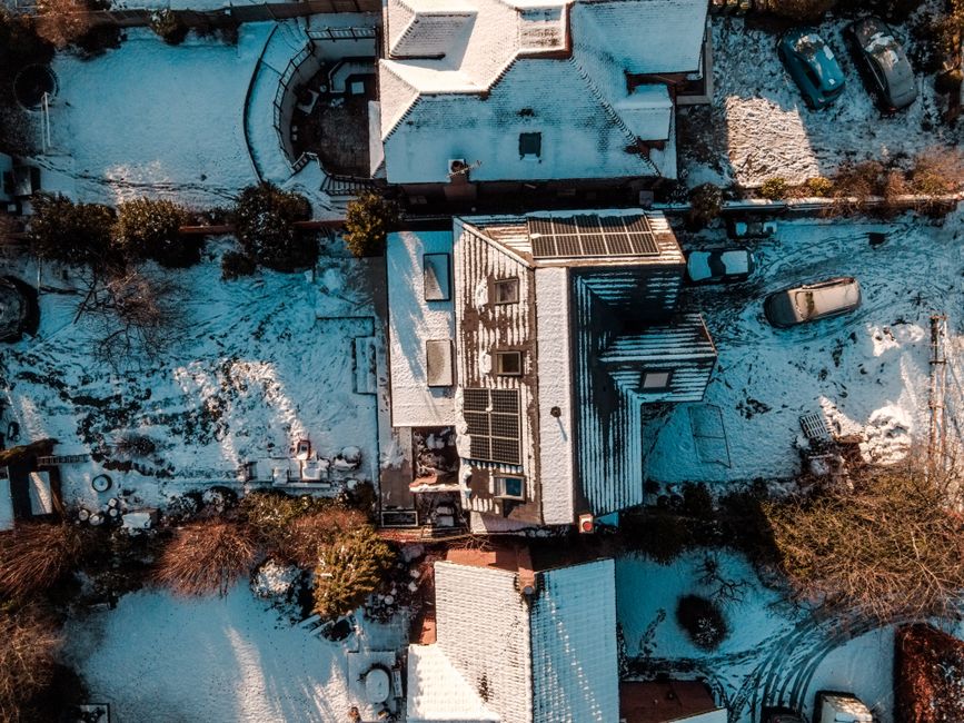 Snow-covered rooftops of a residential neighborhood in winter