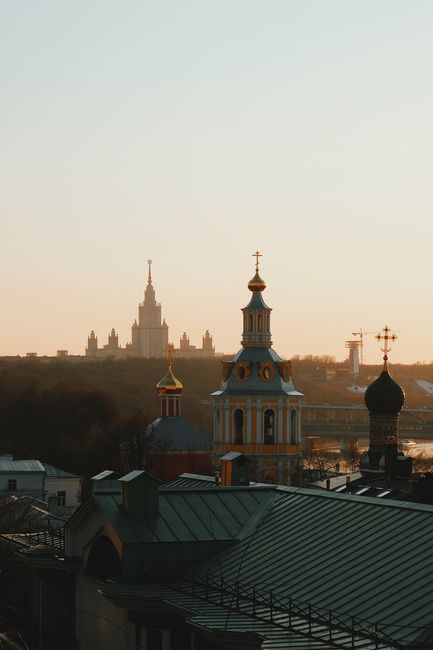 Breathtaking view of Moscow's skyline, featuring iconic church towers at sunset.