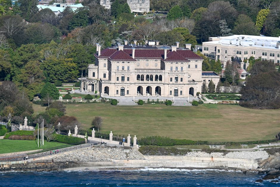 A stunning aerial view of The Breakers mansion in Newport, overlooking the Atlantic coast.