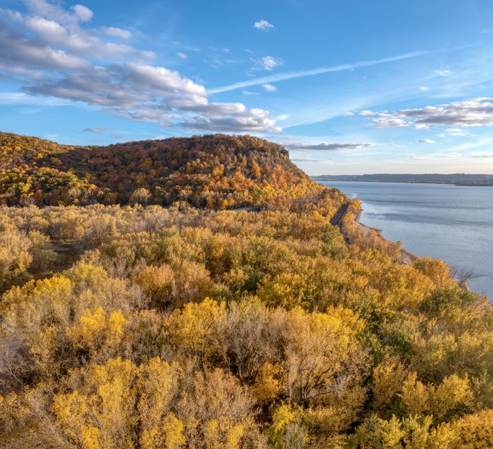 Fall foliage above a river valley with colorful forests