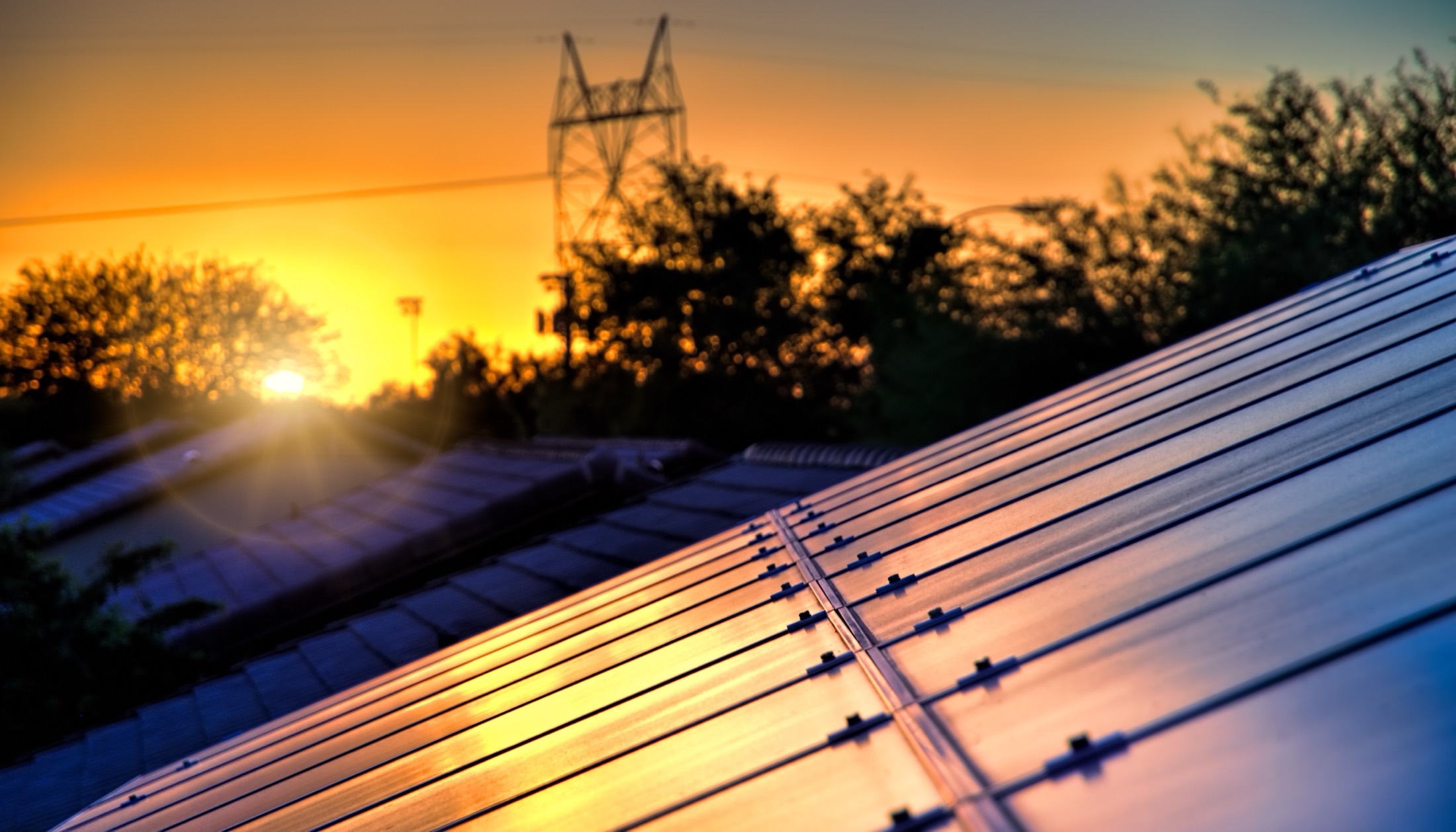Solar panels on a roof at golden sunset