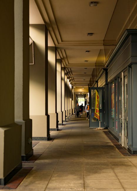 A perspective view of a stylish shopping corridor with elegant columns in Rockville, Maryland.