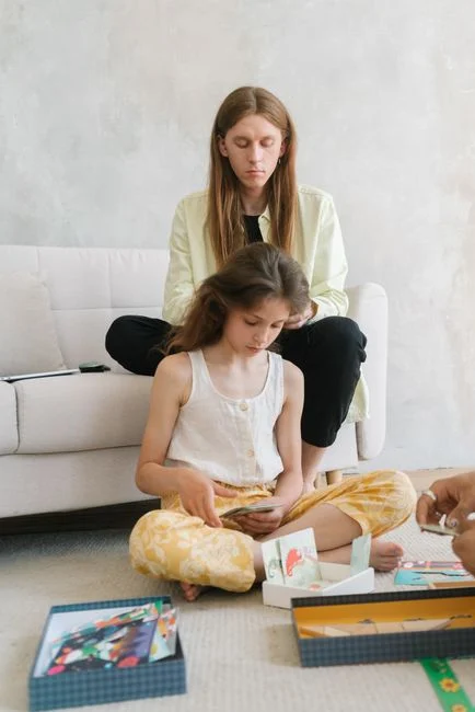 Father playing board games with daughter indoors, fostering family bonding and fun.