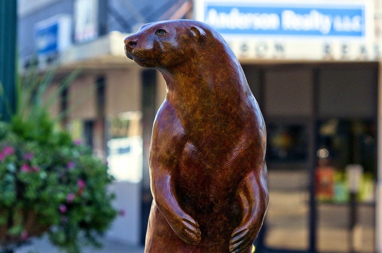 River otter, river king, sculpture, statue, figure, face, otter, 2014 river walk, yankton, south dakota, bronze